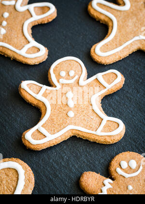 Christmas gingerbread man cookies on a dark background. Stock Photo