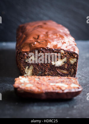 Gluten-free chocolate cake made with green banana flour, dates and nuts. Stock Photo