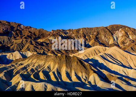 Zabriskie Point is a part of Amargosa Range located in east of Death Valley in Death Valley National Park in the United States noted for its erosional Stock Photo