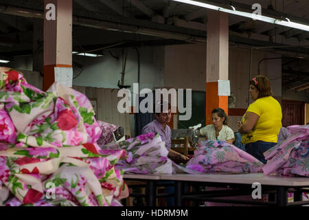 Women machinists working in clothing factory, Vinales, Cuba Stock Photo
