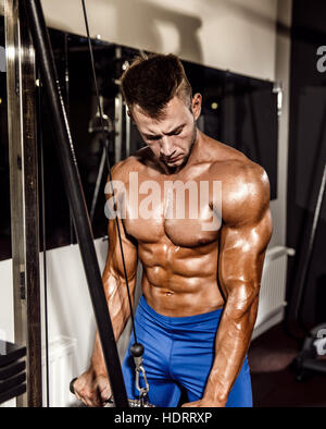 Young Bodybuilder Doing Heavy Weight Exercise For Triceps Stock Photo