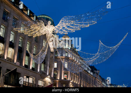 London, UK. 13th Dec, 2016. Christmas lights compositions in Regent Street and Mayfair. The 2016 display is a throwback to Regent Street's first set of Christmas lights, which went up in 1954. The decorations will form one part of a wider display that will run all the way from Oxford Circus to Waterloo Place via Piccadilly and St James's. Credit:  Alberto Pezzali/Pacific Press/Alamy Live News Stock Photo