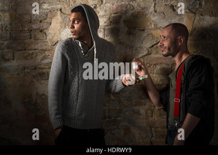 Drug addict buying narcotics and drugs Stock Photo