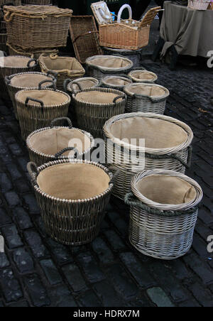 Round wicker baskets for sale in cobbled market place Beverley, Yorkshire, England Stock Photo
