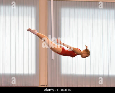 Orenburg, Russia - December 4, 2016: Girls compete in jumping on the trampoline on competitions at the Orenburg region among Juniors Stock Photo