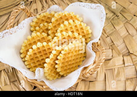 delicious homemade waffles in a wooden basket Stock Photo