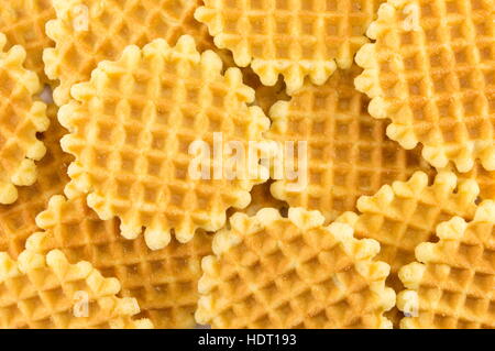 Bunch of golden baked waffle cookies background Stock Photo