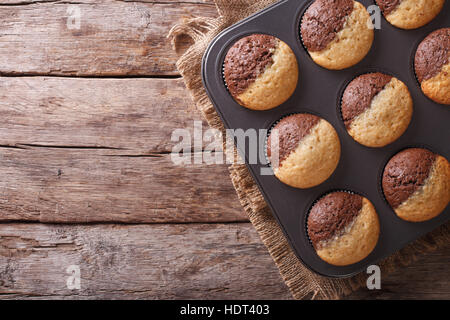 hot colorful cupcakes in a baking dish. horizontal view from above Stock Photo