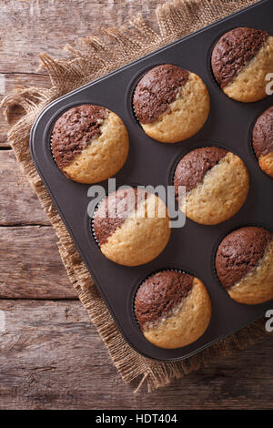 hot colorful cupcakes in a baking dish. Vertical view from above Stock Photo