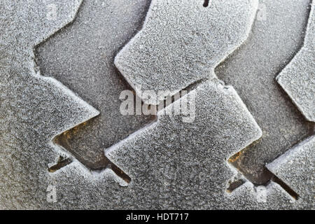 Hoarfrost on a rubber tire wheel. Morning frost. Stock Photo