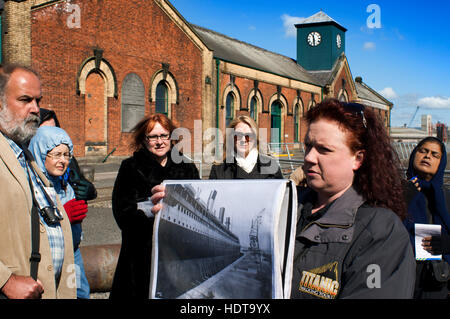 Former thompsons dry graving dock where the Titanic was built in titanic quarter queens island, Belfast Northern Ireland, UK. A guide shows the histor Stock Photo