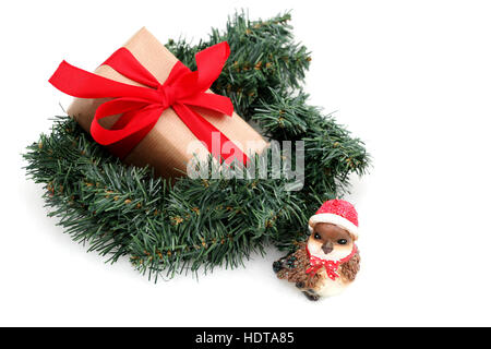 A Christmas present in a wreath with a Robin in front Stock Photo