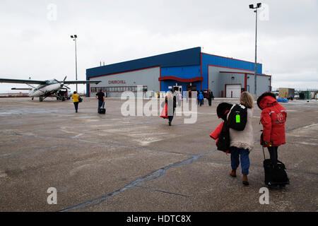 People on the runway at the airport in Churchill, Manitoba, Canada. Stock Photo