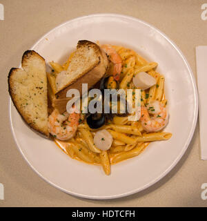 Seafood pasta and garlic bread served at Gypsy's Bakery in Churchill, Canada. Stock Photo