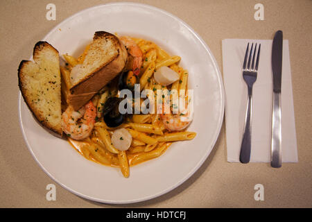 Seafood pasta and garlic bread served at Gypsy's Bakery in Churchill, Canada. Stock Photo