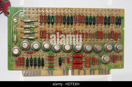 old vintage printed circuit board with electronic components closeup Stock Photo