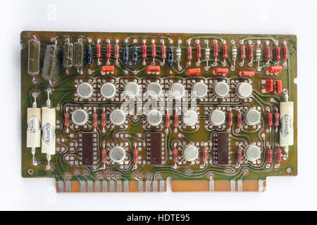 old vintage printed circuit board with electronic components closeup Stock Photo