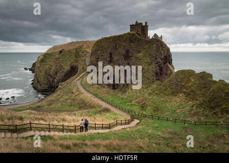 Dunnottar Castle near Aberdeen in North East Scotland is a ruined cliff top fortress  on a rocky outcrop just off the shore. Stock Photo