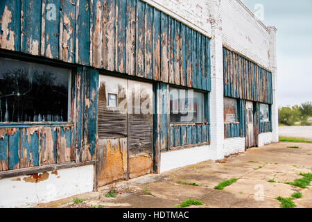 Abandoned empty deteriorating old derelict building in disrepair in tiny town of Washington, Oklahoma, USA. Stock Photo