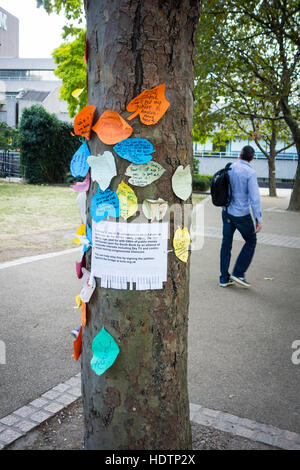 Notice to sign a petition against the Garden Bridge pinned to a tree at risk of removal, Southbank, London, UK Stock Photo