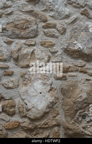 sample of old stonework wall close-up. vertical background Stock Photo