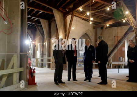 The Prince of Wales (third left) talks with project architect Ptolemy Dean (second left) Clerk of Works Jim Vincent (left) and the Dean of Westminster John Hall during his visit to The Queen's Diamond Jubilee Galleries, at Westminster Abbey in London. Stock Photo