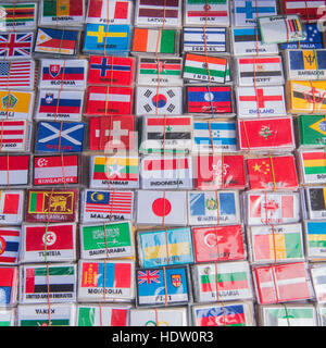 country flag stickers at the marketstreet near the Khao San Roda in the city of Bangkok on 7. 12. 2016 in Thailand Stock Photo