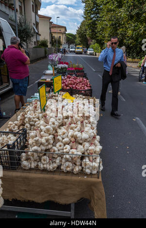 Lucca city street market stretches from the Porta Santa Maria along the Via Borga Giannotti with everything from food to pets. Stock Photo