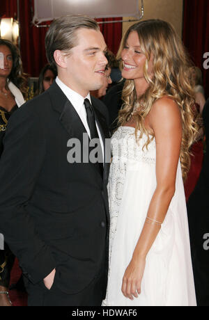 Gisele Bundchen and Leonardo DiCaprio arrives at the 77th Annual Academy Awards  in Los Angeles on Feb. 21, 2005. Photo credit: Francis Specker Stock Photo