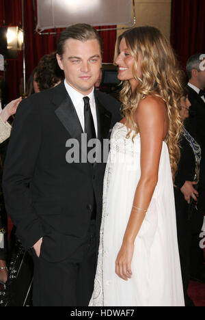 Leonardo DiCaprio and his girlfriend, Gisele Bundchen, arrives at the 77th Annual Academy Awards  in Los Angeles on Feb. 21, 2005. Photo credit: Francis Specker Stock Photo