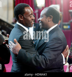 Paul Rusesabagina, right, and Don Cheadle  at the 77th Annual Academy Awards  in Los Angeles on Feb. 27, 2005. Photo credit: Francis Specker Stock Photo