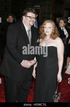 Director Michael Moore and his wife Kathleen arrive at the People's Choice Awards in Pasadena, California on Sunday January 9, 2005. Photo credit: Francis Specker Stock Photo