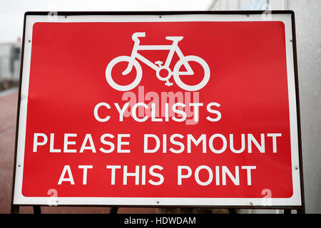 Cyclist dismount. Stock Photo