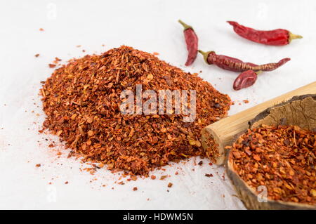 Ground red pepper and dried peppers closeup Stock Photo