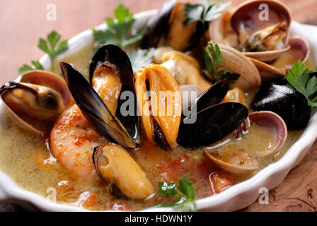 seafood soup in white bowl Stock Photo