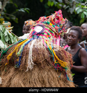 Mende people dance with gbeni mask in Gola Rain Forest Stock Photo