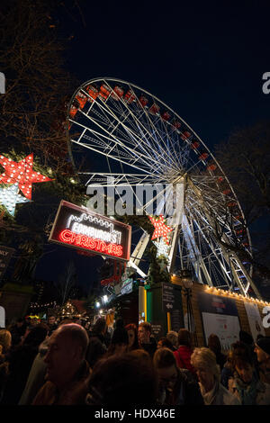 Edinburgh Christmas tourism, Scotland - Christmas Market, Princes Street. Big wheel in fair. Stock Photo