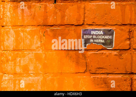India stop blockade in Nepal poster at a brick wall Stock Photo