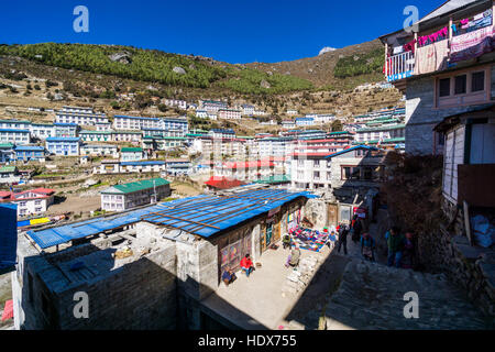 View on Namche Bazaar with hills and trees in the distance. Stock Photo