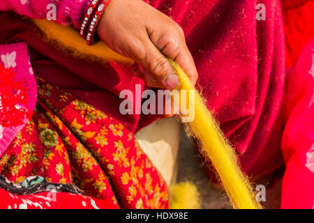 Hands of a woman are producing felt balls Stock Photo