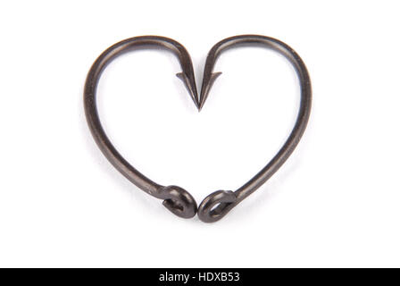 Two fishhook drawn up in heart shaped isolated on white backround. Clipping path Stock Photo