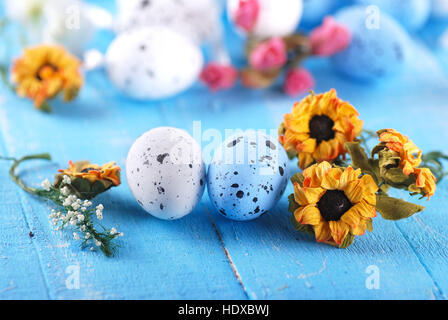 decorated eggs for Easter on blue table Stock Photo