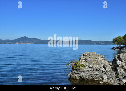 Lake Bracciano viewed from Anguillara Sabazia waterfront with ancient ruins Stock Photo