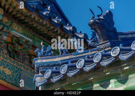 Temple of Heaven, detail of figures on blue ceramic roof tile at Beijing, China illustrating imperial roof decoration in Chinese architecture. Stock Photo