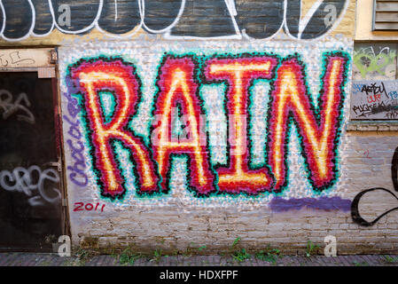 "Rain" graffiti painted on a wall in Olympia, Washington. Stock Photo