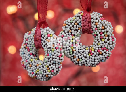 Closeup of round Christmas cookies on red background Stock Photo