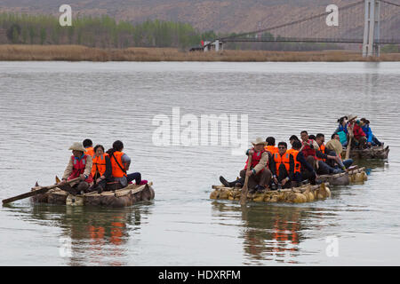 Chinese tourists on Yellow River raft, Shapotou Scenic Area, Zhongwei, Ningxia, China Stock Photo
