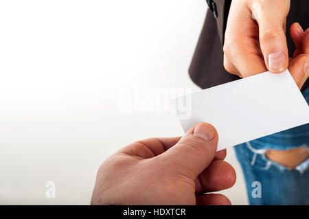Exchanging business card with business partner Stock Photo