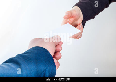 Exchanging business card with business partner Stock Photo