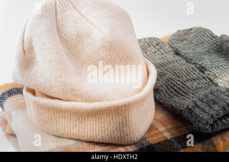 Mittens scarf hat on withe background Stock Photo